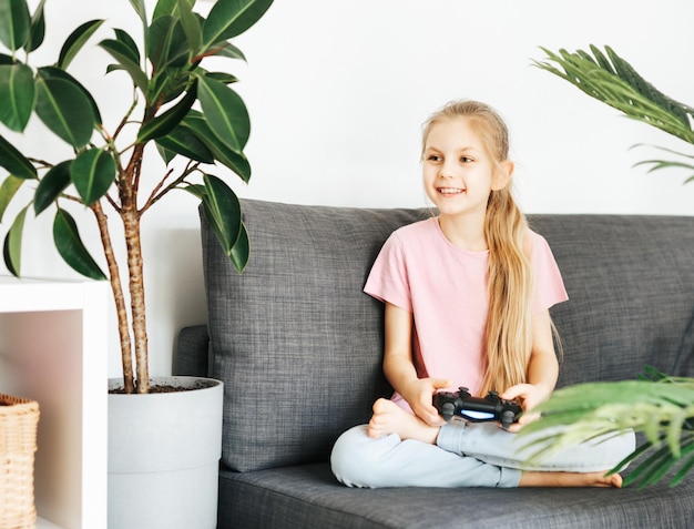 Girl playing video game at home