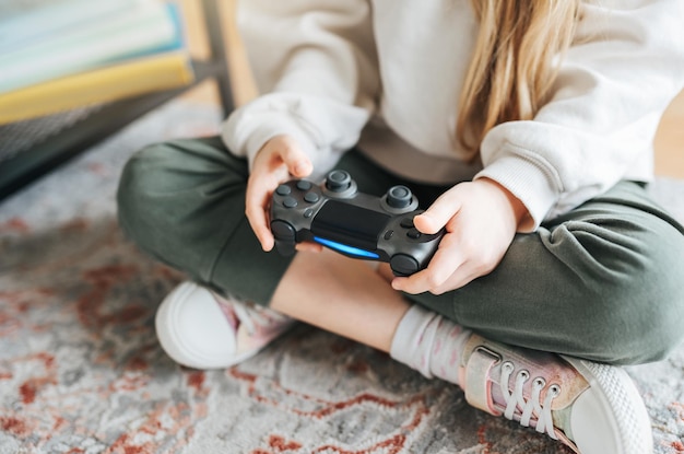 Girl playing video game at home