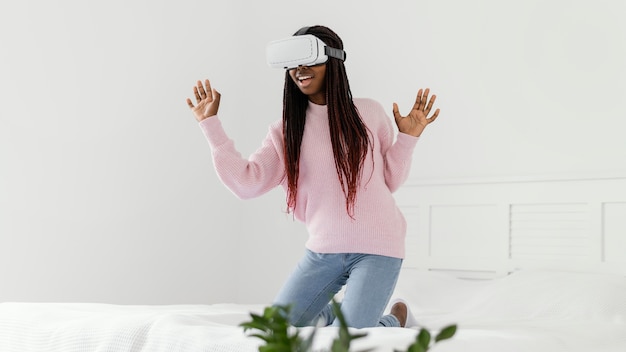 Girl playing videogames with vr glasses