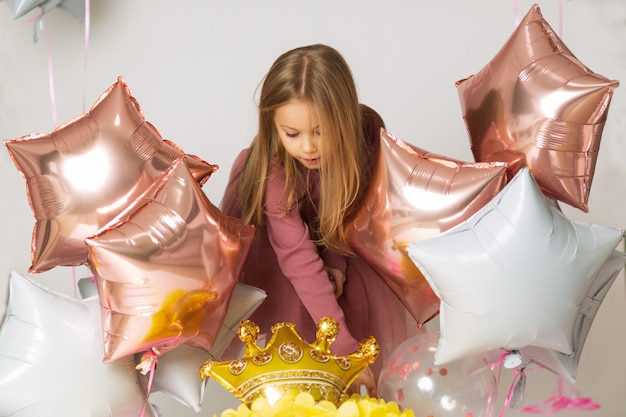 Girl playing with balloons