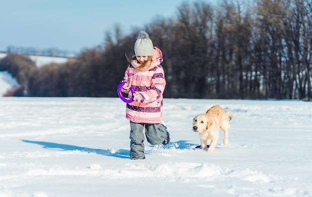 Girl playing with dog outside