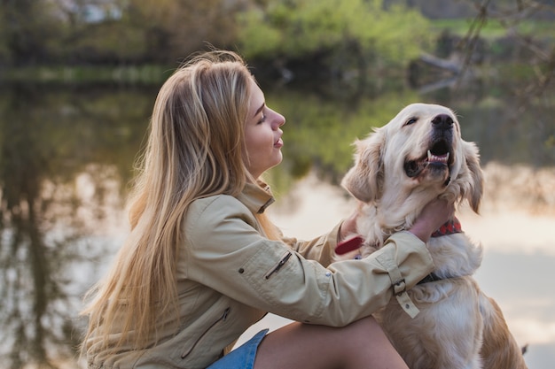 girl playing with a dog