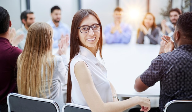 Girl posing for the camera sitting at a round table