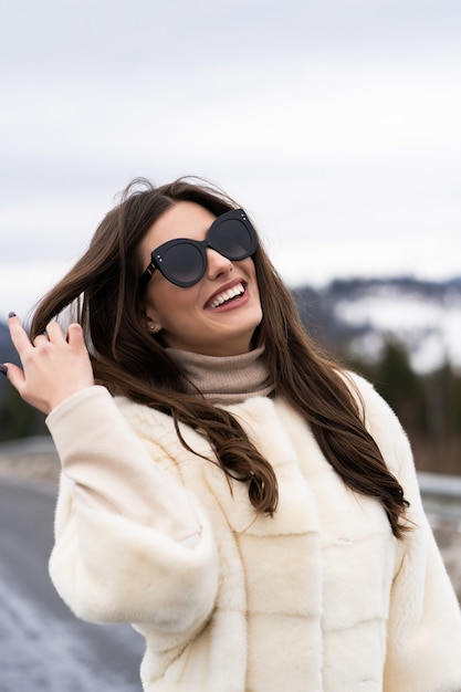 Girl posing on road on winter woods