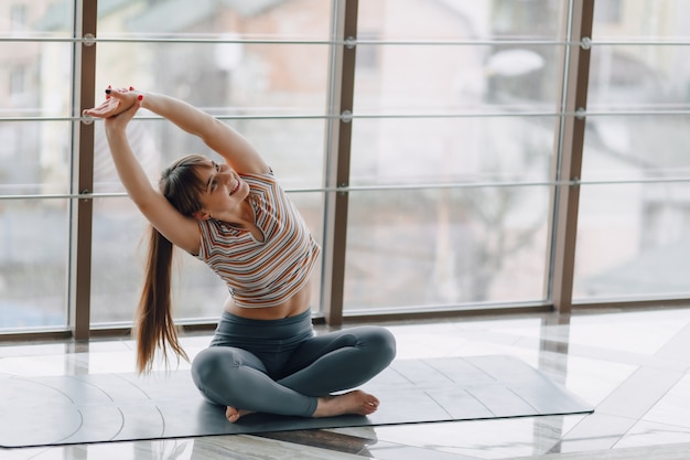 Girl practice yoga, sports and healthy lifestyles, the concept of mental balance