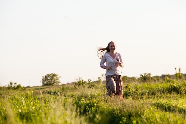 The girl ran across the field