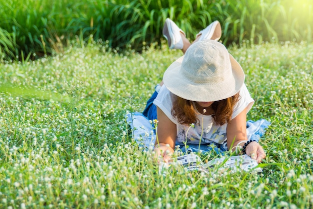 girl reading book in tha park