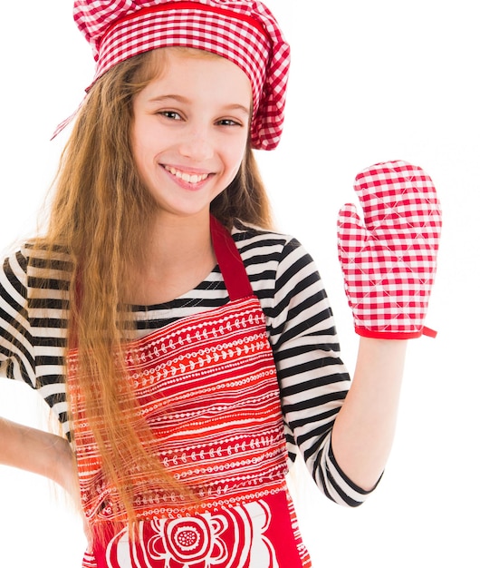 Girl in red apron and baking glove