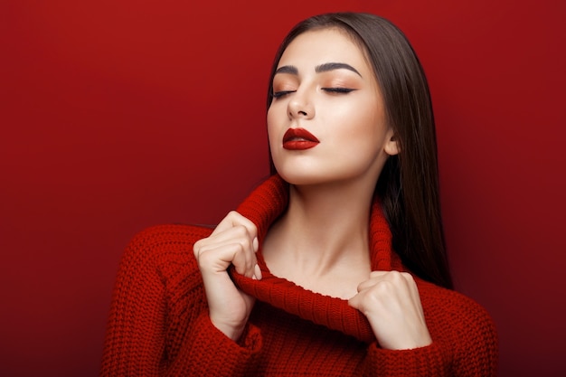 a girl in red on a red background