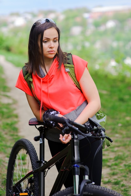 Girl riding a bike in the woods