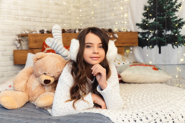 Girl in a room with Christmas decorations