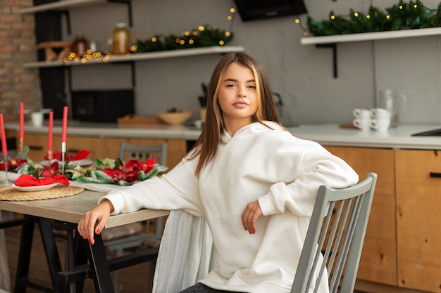 Girl in a room with Christmas decorations