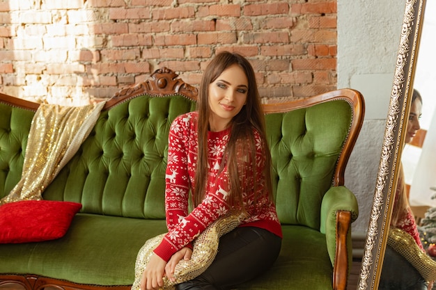 Girl in a room with Christmas decorations