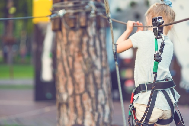 Girl on ropeway in the park blurred