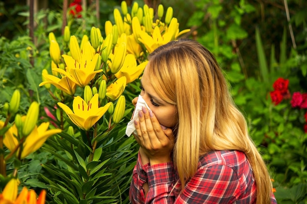 Girl's allergy to flowers. Selective focus