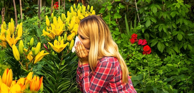 Girl's allergy to flowers. Selective focus