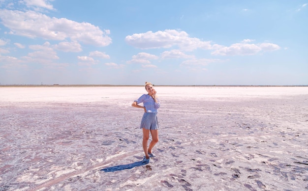 A girl on a salty pink lake