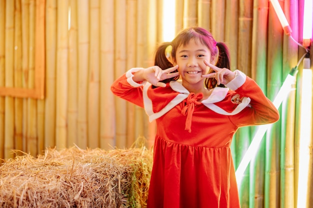 The girl in Sandy costume is playing, smiling, laughing, having fun.