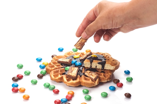 Girl served waffles with blueberry jam, Breakfast with coffee.