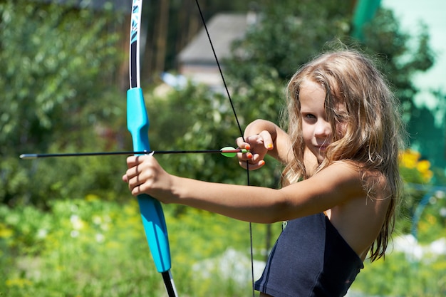 Girl shoots a bow