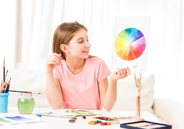 Girl showing her drawing