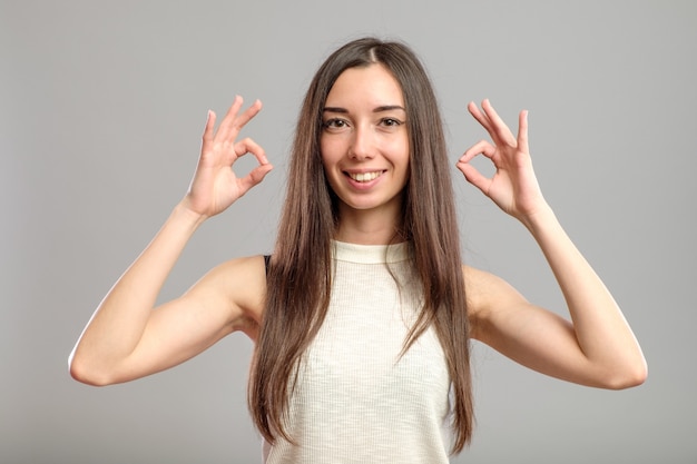 Girl showing OK sign