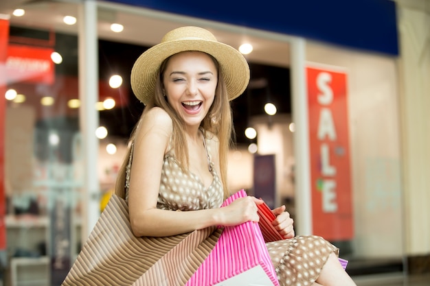 Girl smiling with a straw hat