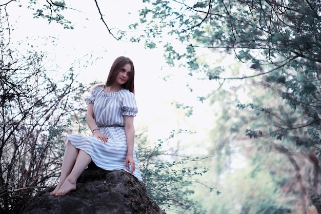 A girl in a spring green park on a walk