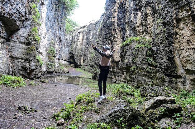 The girl in the Stone Bowl Gorge A gorge in the mountains of the landscape nature of Dagestan Russia