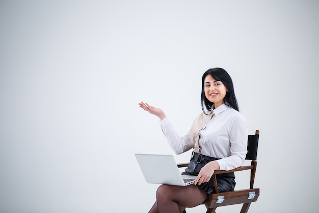 Girl teacher, businessman is studying a new project on a laptop. Working day concept