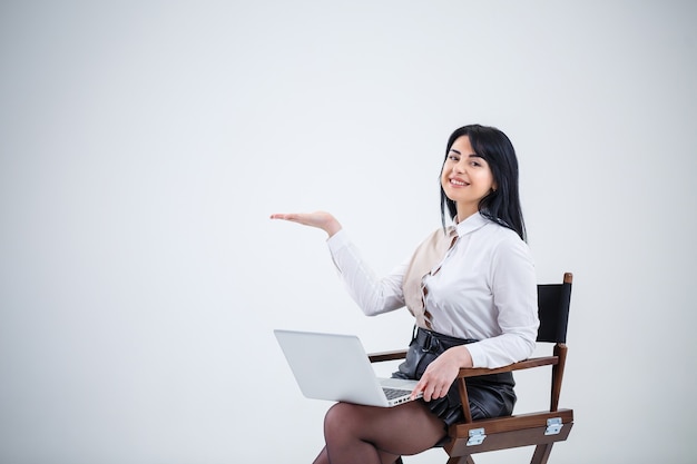 Girl teacher, businessman is studying a new project on a laptop. Working day concept