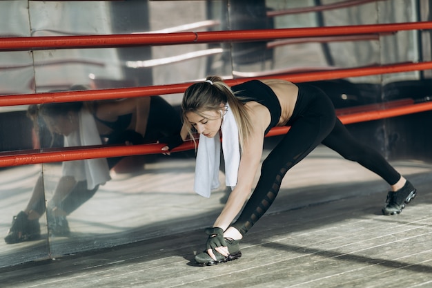 Girl training morning workout in the gym. Young woman doing gym workout in the gym. Healthy and sport lifestyle