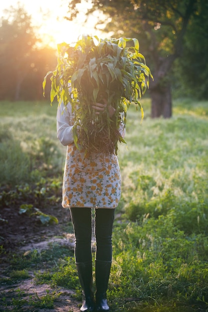 Girl in the village works in the garden