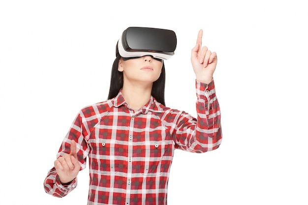 Girl in VR headset making choose and pointing by fingers.