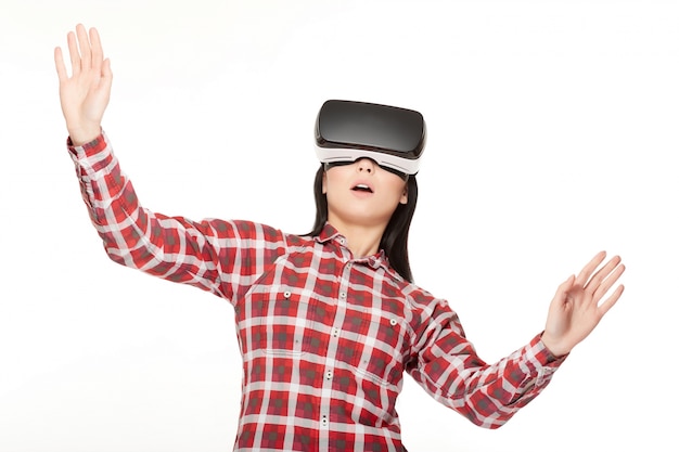 Girl in VR surprised looking up and playing game.