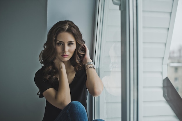 The girl in waiting sitting on the window sill 4967