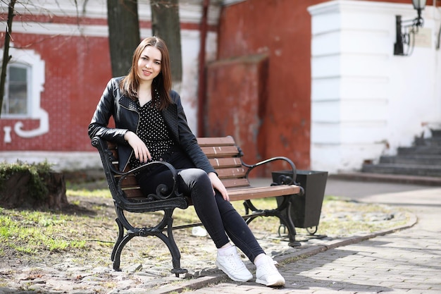 Girl on a walk through the spring city on a sunny day