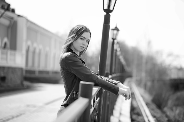 Girl on a walk through the spring city on a sunny day