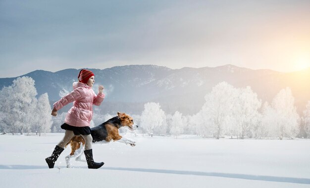 Girl walking with dog in winter. Mixed media