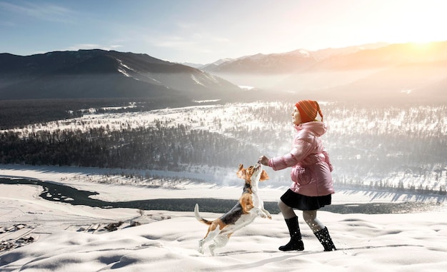 Girl walking with dog in winter. Mixed media