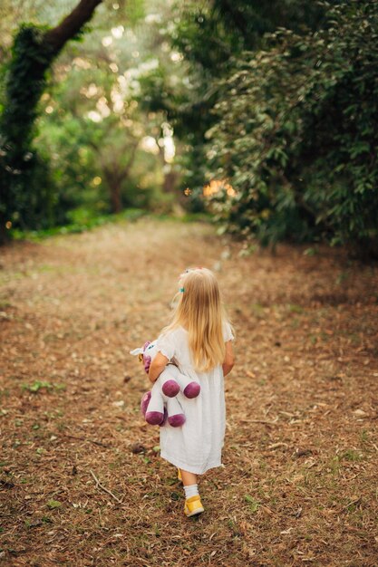 Girl walks in the woods