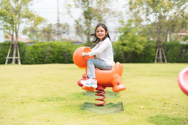 The girl was happily playing in the garden