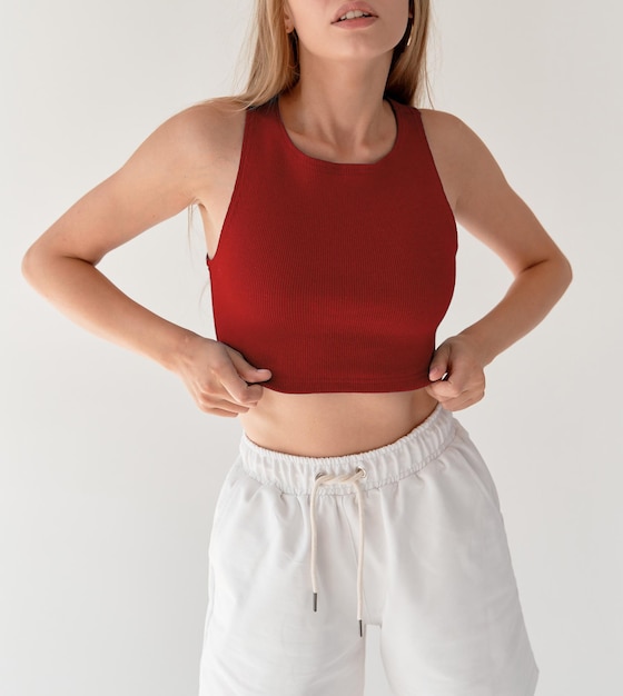 Photo girl wears red crop top and white shorts