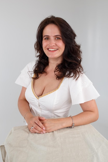 Girl in a white dress on a white background