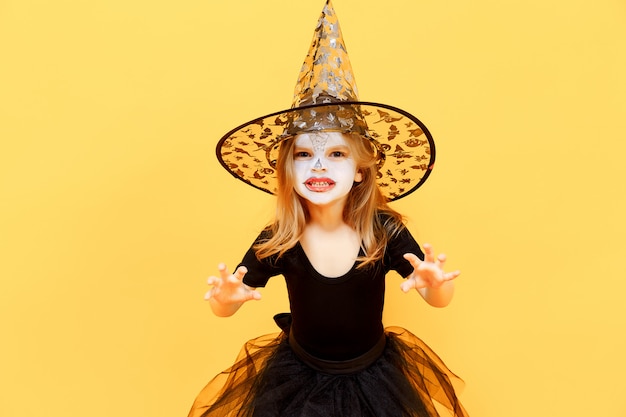 Girl in witch Halloween costume