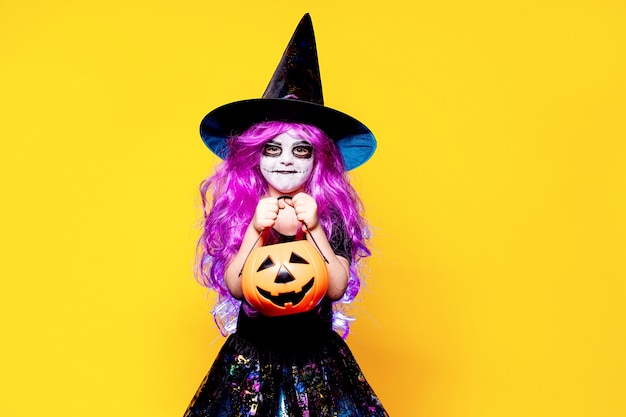 Girl in witch Halloween costume