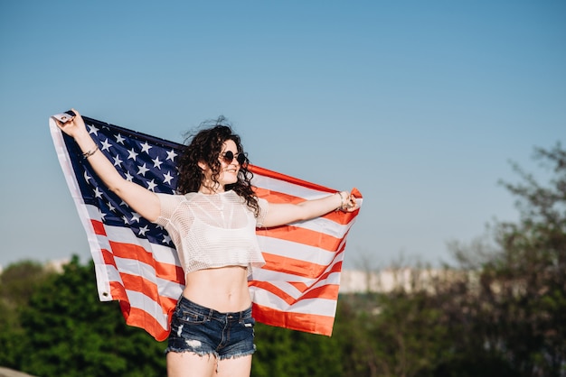 Girl with an American flag Independence Day 