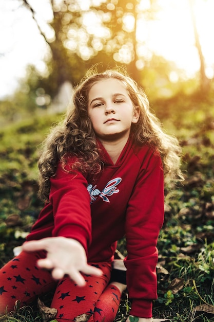 Girl with arm outstretched toward camera