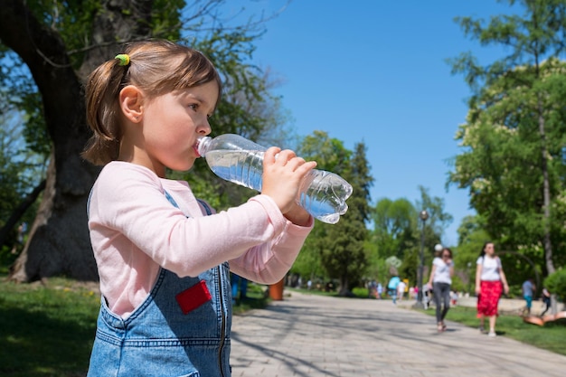 The girl with a bottle of drinking water