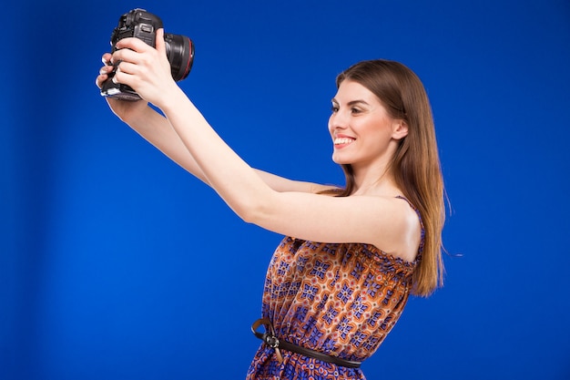 Girl with a camera in his hands